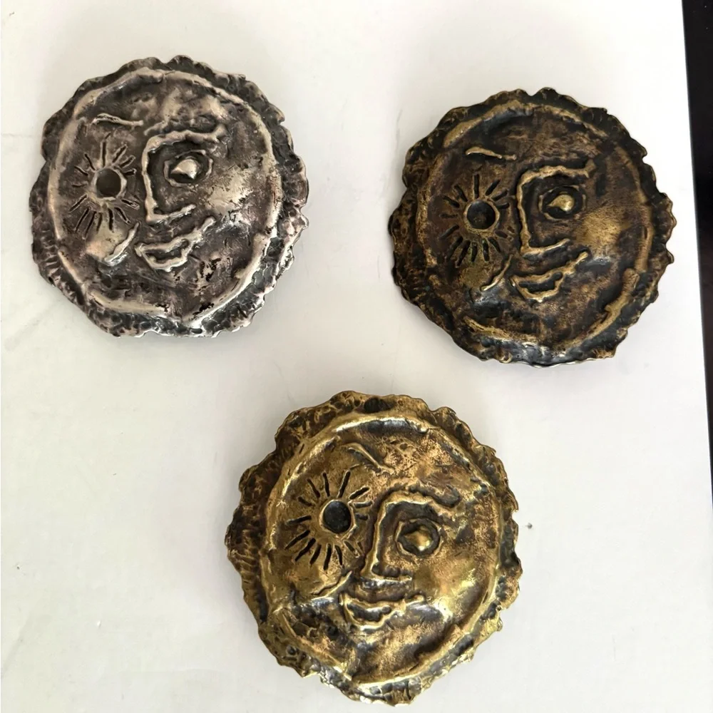 Three vintage belt buckles